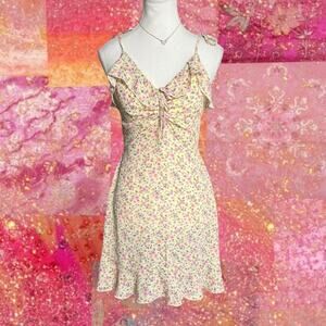 Yellow floral mini dress with ruffle details and tie straps Spring Dress Size M